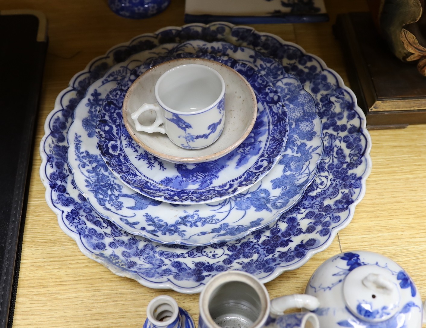 A collection of mostly Japanese blue and white ceramics, late 19th/early 20th century, including a Seto two handle vase, 27 cm high